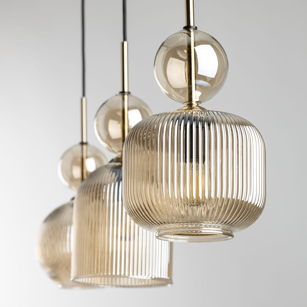 SOPHIA cognac ribbed glass linear pendant against a plain background