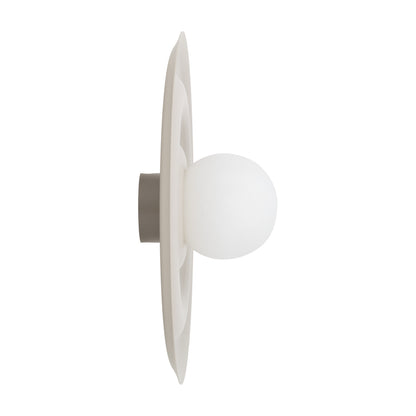 ONDA Scandinavian wall sconce with its smooth opal glass shade set into the centre of the wavy disc