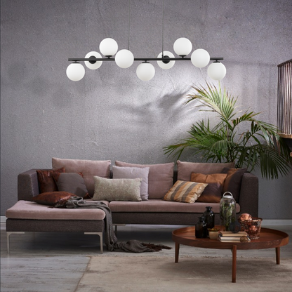 ESTERA 9-light black pendant styled over a kitchen island